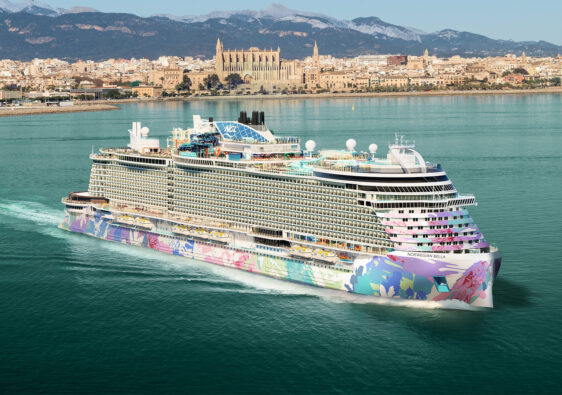 Norwegian Bella cruise ship sailing at sea with colorful hull artwork